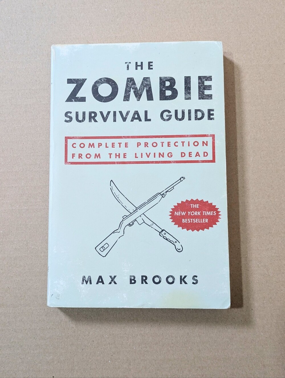 **3/$16 SALE - The Zombie Survival Guide by Max Brooks - White Cover